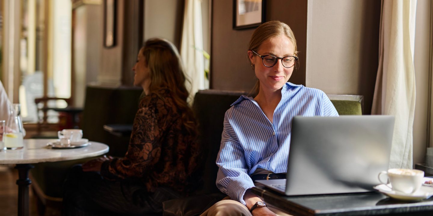 Woman sitting at her notebook in the café