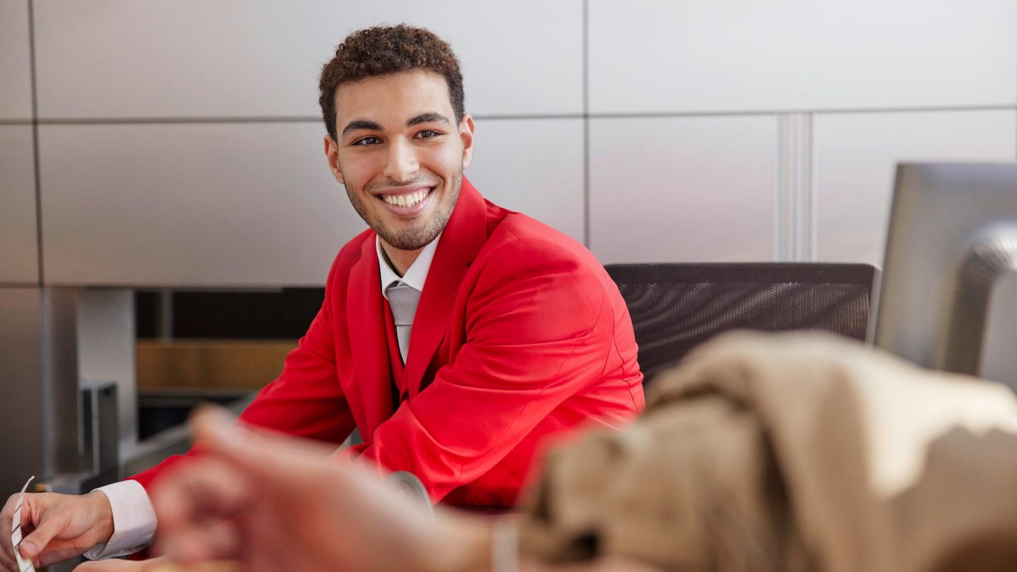 Smiling man in airline uniform. 