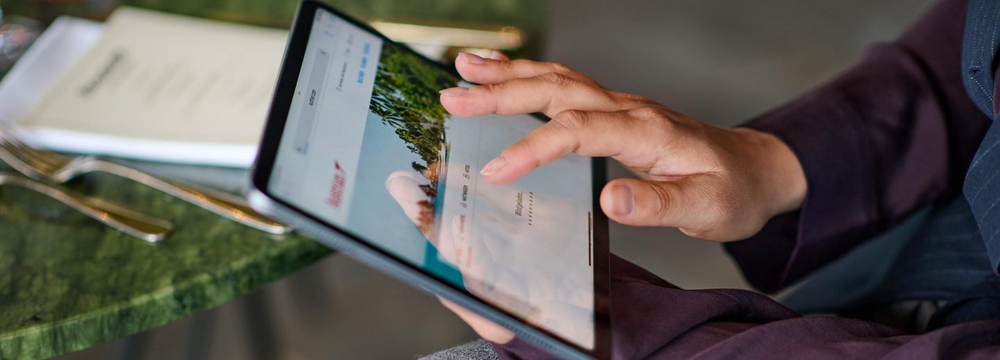 Person looking at the Austrian website on a tablet