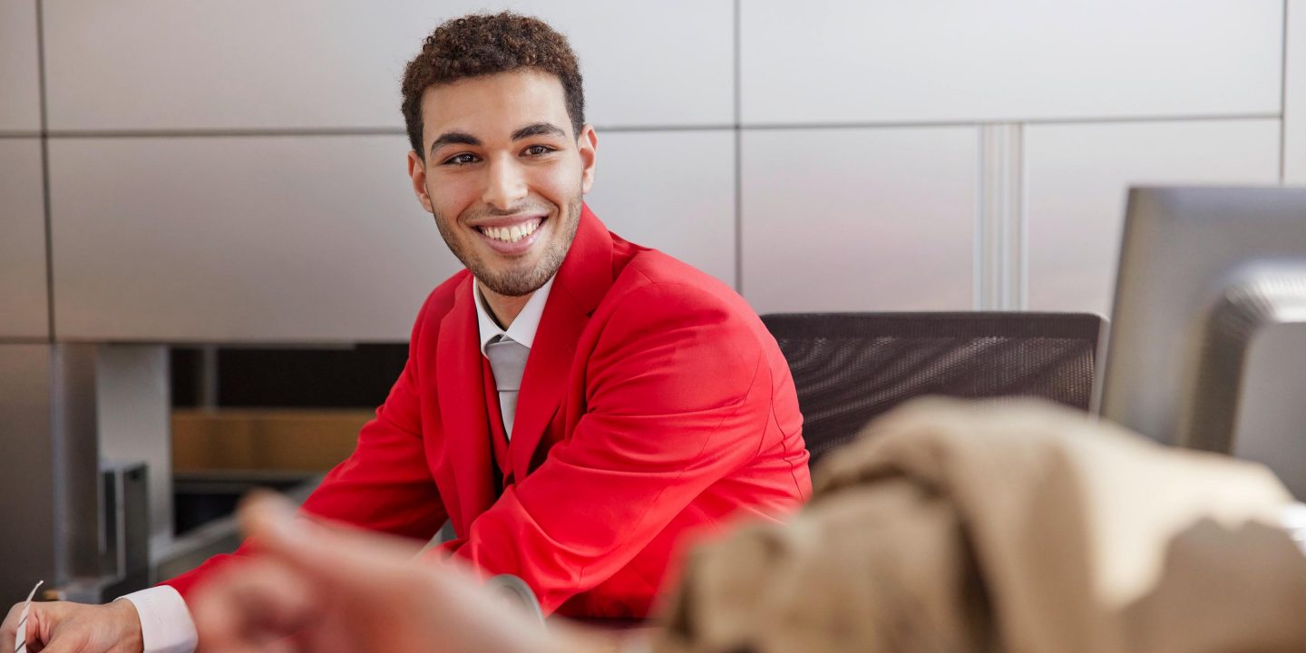 Smiling man in airline uniform. 