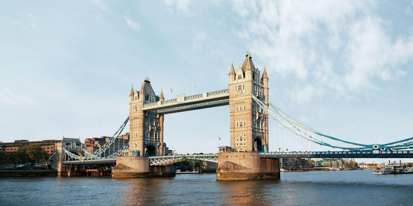 Tower Bridge in London, a renowned landmark, with entry regulations for the UK noted.