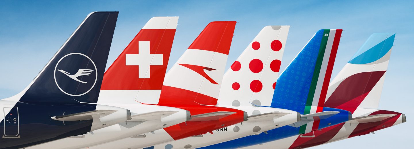 Tail fins of five Lufthansa Group airlines lined up side-by-side.